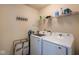 Clean and organized laundry room featuring modern washer and dryer at 6683 School Branch Dr, Brownsburg, IN 46112