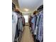 Spacious walk-in closet with ample storage space, shelving, and natural light from a window at 6683 School Branch Dr, Brownsburg, IN 46112