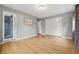 Large bedroom with wood floors, closet, and adjacent bathroom with tiled shower at 6839 Chaucer Ct, Indianapolis, IN 46220