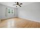 Bright bedroom with hardwood floors, ceiling fan, and ample natural light at 6839 Chaucer Ct, Indianapolis, IN 46220