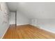 Angle of bedroom with hardwood floors, gray paint, and white closet doors at 6839 Chaucer Ct, Indianapolis, IN 46220