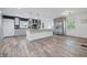 Beautiful kitchen featuring new tile floors, gray cabinets and stainless steel appliances at 6839 Chaucer Ct, Indianapolis, IN 46220