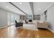 Open-concept living room featuring hardwood floors, fireplace, built-in shelves, and recessed lighting at 6839 Chaucer Ct, Indianapolis, IN 46220
