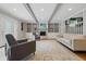 Bright living room with hardwood floors, fireplace, built-in shelves, and recessed lighting at 6839 Chaucer Ct, Indianapolis, IN 46220