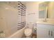 Clean bathroom featuring a shower-tub combo, toilet, and vanity with ample counter space at 7234 Darley Ln, Indianapolis, IN 46259