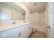 Well-lit bathroom with double sinks, tile flooring, and a shower-tub combination with modern fixtures at 7234 Darley Ln, Indianapolis, IN 46259