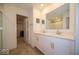 Bright bathroom featuring double sinks, a large mirror, and a walk-in shower with a glass door at 7234 Darley Ln, Indianapolis, IN 46259
