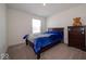Cozy bedroom features a comfortable bed, dresser, and plush carpet at 7234 Darley Ln, Indianapolis, IN 46259