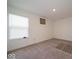 Bright and airy bedroom with a large window, neutral carpet, and a tranquil, comfortable setting at 7234 Darley Ln, Indianapolis, IN 46259