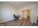 Office room with wood floors, an office chair, and views of nearby rooms at 7234 Darley Ln, Indianapolis, IN 46259