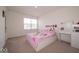 Bright bedroom featuring carpet, large window, and desk with vanity at 7234 Darley Ln, Indianapolis, IN 46259