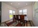Bright dining room with large windows and sliding door, perfect for Gathering meals and entertaining at 7234 Darley Ln, Indianapolis, IN 46259