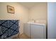 Bright laundry room featuring a side-by-side washer and dryer and neutral paint at 7234 Darley Ln, Indianapolis, IN 46259
