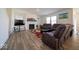 Spacious living room with modern flooring, a fireplace, and comfortable seating at 7234 Darley Ln, Indianapolis, IN 46259