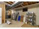 Unfinished basement utility area with water heater and storage shelving at 7372 Fox Hollow Rdg, Zionsville, IN 46077