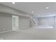 Spacious finished basement with neutral paint, recessed lighting, and plush carpeting at 7372 Fox Hollow Rdg, Zionsville, IN 46077