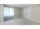 Bedroom features neutral walls, carpet, window, and double door closet at 7372 Fox Hollow Rdg, Zionsville, IN 46077