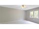 Bedroom features neutral walls, carpet, window, and a ceiling fan at 7372 Fox Hollow Rdg, Zionsville, IN 46077