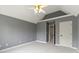 Bedroom with carpet, neutral walls, ceiling fan, and door to ensuite at 7372 Fox Hollow Rdg, Zionsville, IN 46077