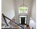 Grand foyer with high ceilings, a large front door, and staircase with black trim at 7372 Fox Hollow Rdg, Zionsville, IN 46077