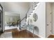 Inviting foyer showcases hardwood floors, a staircase, and a glimpse of the living room at 7372 Fox Hollow Rdg, Zionsville, IN 46077