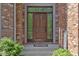 Elegant front door with decorative glass and brick facade, creating a welcoming entrance at 7372 Fox Hollow Rdg, Zionsville, IN 46077