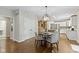 Bright kitchen leading to a dining area, featuring modern appliances and ample cabinet space at 7372 Fox Hollow Rdg, Zionsville, IN 46077