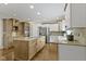 Spacious kitchen featuring custom cabinets, stainless steel appliances, and a large center island at 7372 Fox Hollow Rdg, Zionsville, IN 46077
