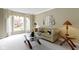 Cozy living room with large windows, neutral tones, and comfortable seating at 7372 Fox Hollow Rdg, Zionsville, IN 46077