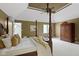 Bright main bedroom with a four-poster bed, ample closet space, and neutral decor at 7372 Fox Hollow Rdg, Zionsville, IN 46077