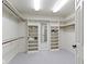 Spacious walk-in closet with custom shelving and ample storage space at 7372 Fox Hollow Rdg, Zionsville, IN 46077
