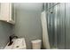 Bathroom featuring a faucet, toilet, walk-in shower, and medicine cabinet for storage at 7730 Bear Creek Rd, Morgantown, IN 46160