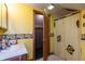 A full bathroom with a sunflower shower curtain, and sink vanity at 7730 Bear Creek Rd, Morgantown, IN 46160