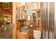 Rustic powder room featuring a galvanized metal sink and wooden decor elements at 7730 Bear Creek Rd, Morgantown, IN 46160