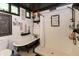 Modern farmhouse bathroom with a soaking tub and step-in shower at 7730 Bear Creek Rd, Morgantown, IN 46160
