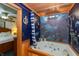 Bathroom with whirlpool tub features nautical themes and offers a view of the bedroom at 7730 Bear Creek Rd, Morgantown, IN 46160
