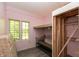 Bedroom with built-in bunk bed and plenty of natural light streaming through the window at 7730 Bear Creek Rd, Morgantown, IN 46160