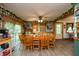 Dining area with wood table, chairs, and adjacent kitchen, perfect for Gathering meals at 7730 Bear Creek Rd, Morgantown, IN 46160