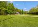 A beautiful home nestled in a lush, green landscape with a well-maintained lawn at 7730 Bear Creek Rd, Morgantown, IN 46160