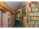 A hallway with built-in bookshelves filled with books, offering a cozy and inviting reading nook at 7730 Bear Creek Rd, Morgantown, IN 46160