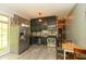 Modern kitchen with stainless steel appliances and a breakfast nook with natural light at 7730 Bear Creek Rd, Morgantown, IN 46160