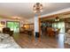 Inviting living room with wood floors, comfortable furnishings, and access to outdoor areas at 7730 Bear Creek Rd, Morgantown, IN 46160