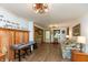 Bright living room with wood-look floors, keyboard, and rustic-style decor at 7730 Bear Creek Rd, Morgantown, IN 46160