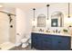 Modern bathroom features a double sink vanity, marble tiled shower, and stylish fixtures at 7771 Delbrook Dr, Indianapolis, IN 46260