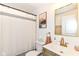 Cozy bathroom featuring a single sink vanity, art, and modern fixtures at 7771 Delbrook Dr, Indianapolis, IN 46260