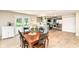 Eat-in kitchen with modern green cabinets, stainless appliances, and an inviting breakfast bar at 7771 Delbrook Dr, Indianapolis, IN 46260