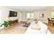 Bright living room with a large sectional sofa and modern entertainment setup at 7771 Delbrook Dr, Indianapolis, IN 46260
