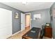 Office space features a desk, natural light, and neutral-toned walls at 7771 Delbrook Dr, Indianapolis, IN 46260