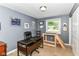 Office space featuring a desk, natural light, and unique wooden structures at 7771 Delbrook Dr, Indianapolis, IN 46260