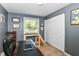 Office space featuring a desk, natural light, and neutral-toned walls at 7771 Delbrook Dr, Indianapolis, IN 46260